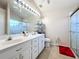 Bathroom boasts double sinks, a large shower, and plenty of storage at 3713 Doune Way, Clermont, FL 34711