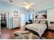 Spacious bedroom with large bed, dresser, and walk-in closet at 3713 Doune Way, Clermont, FL 34711