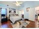 Peaceful Primary bedroom with a king-size bed and access to a sunroom at 3713 Doune Way, Clermont, FL 34711