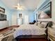 Bright bedroom with a king-size bed and plenty of natural light at 3713 Doune Way, Clermont, FL 34711