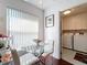 Cozy breakfast nook with a glass table and chairs, near the kitchen and laundry at 3713 Doune Way, Clermont, FL 34711