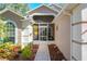 Inviting front entry with a screened porch and walkway at 3713 Doune Way, Clermont, FL 34711