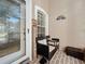 Cozy front porch with seating area and brick flooring at 3713 Doune Way, Clermont, FL 34711