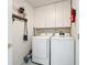 Laundry room with washer, dryer, cabinets, and storage at 3713 Doune Way, Clermont, FL 34711