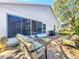 Relaxing patio with seating area and lush landscaping at 3713 Doune Way, Clermont, FL 34711