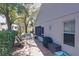 Spacious patio with seating area, grill, and lush landscaping at 3713 Doune Way, Clermont, FL 34711