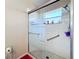 Large walk-in shower with glass enclosure and tiled flooring at 3713 Doune Way, Clermont, FL 34711