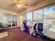 Bright sunroom with table, chairs, and view of backyard at 3713 Doune Way, Clermont, FL 34711