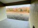 Covered patio overlooking the backyard and trees at 4456 Sagefield Dr, Harmony, FL 34773
