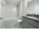 Bathroom with granite countertop and a shower/tub combo at 4456 Sagefield Dr, Harmony, FL 34773