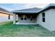 Covered patio and grassy backyard at 4464 Sagefield Dr, Harmony, FL 34773