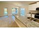 Open concept kitchen with island and breakfast bar at 4464 Sagefield Dr, Harmony, FL 34773
