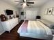 Main bedroom with king-size bed and dark wood floors at 4768 Tangerine Ave # 4768, Winter Park, FL 32792