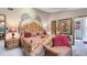 Cozy main bedroom showcasing a detailed wood bed frame, a side chair, and a connecting en suite bathroom at 489 Sugar Ridge Ct, Longwood, FL 32779