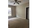Bright bedroom with carpet flooring and ceiling fan at 5548 Metrowest Blvd # 101, Orlando, FL 32811