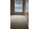 Bright bedroom with neutral carpeting and large window at 5548 Metrowest Blvd # 101, Orlando, FL 32811