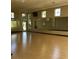 A spacious dance studio features hardwood floors, wall-to-wall mirrors and lots of natural light at 5548 Metrowest Blvd # 101, Orlando, FL 32811
