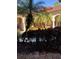 Landscaped courtyard with tropical plants and building view at 5548 Metrowest Blvd # 101, Orlando, FL 32811