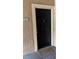 Inviting condo entry with black door and welcome mat at 5548 Metrowest Blvd # 101, Orlando, FL 32811