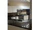 Kitchen with granite counters and white cabinets at 5548 Metrowest Blvd # 101, Orlando, FL 32811