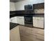 Modern kitchen with white cabinets and granite countertops at 5548 Metrowest Blvd # 101, Orlando, FL 32811