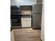 Modern kitchen featuring stainless steel appliances, granite countertops, and white cabinets at 5548 Metrowest Blvd # 101, Orlando, FL 32811