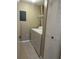 The laundry room includes a washer, a dryer, tile floors, and a full-sized utility closet at 5548 Metrowest Blvd # 101, Orlando, FL 32811