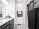 Double vanity bathroom with a shower at 5681 Western Sun Dr, St Cloud, FL 34771
