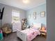 bedroom with twin bed and dresser at 5681 Western Sun Dr, St Cloud, FL 34771
