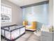 Bedroom with crib, changing table, and play area at 5681 Western Sun Dr, St Cloud, FL 34771