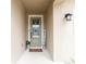 Inviting front door entry with a welcome mat and signage at 5681 Western Sun Dr, St Cloud, FL 34771