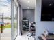 Convenient home office with desk and sliding glass door at 5681 Western Sun Dr, St Cloud, FL 34771