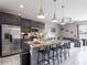 Modern kitchen with granite countertops and pendant lighting at 5681 Western Sun Dr, St Cloud, FL 34771
