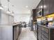 Spacious kitchen with granite counters and dark cabinetry at 5681 Western Sun Dr, St Cloud, FL 34771