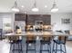 Large kitchen island with seating for four at 5681 Western Sun Dr, St Cloud, FL 34771
