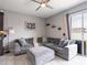 Relaxing living room featuring a sectional sofa and ottoman at 5681 Western Sun Dr, St Cloud, FL 34771
