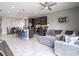 Comfortable living room with sectional sofa and ceiling fan at 5681 Western Sun Dr, St Cloud, FL 34771