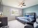 Spacious main bedroom with king bed and seating at 5681 Western Sun Dr, St Cloud, FL 34771