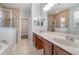 Bathroom with double vanity and walk-in shower at 5791 Covington Cove Way, Orlando, FL 32829