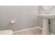 Simple bathroom with pedestal sink and tile flooring at 5791 Covington Cove Way, Orlando, FL 32829