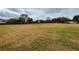 Community field with open grassy area and small orange surface at 5791 Covington Cove Way, Orlando, FL 32829
