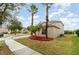 Two-story house with palm trees and landscaped yard at 5791 Covington Cove Way, Orlando, FL 32829