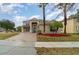 Two-story house with a paved driveway and landscaping at 5791 Covington Cove Way, Orlando, FL 32829