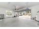 Garage with open door, showing driveway and neighborhood at 5791 Covington Cove Way, Orlando, FL 32829