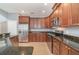 Kitchen with stainless steel appliances and granite countertops at 5791 Covington Cove Way, Orlando, FL 32829