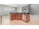 Kitchen island with granite countertop and stainless steel dishwasher at 5791 Covington Cove Way, Orlando, FL 32829