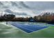 Community tennis courts with blue and green surface at 5791 Covington Cove Way, Orlando, FL 32829