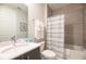 Clean bathroom featuring a shower/tub combo, and a modern sink at 7925 Putting Green Way, Reunion, FL 34747