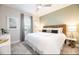 Serene bedroom with neutral tones, a comfortable bed, and tasteful decor at 7925 Putting Green Way, Reunion, FL 34747