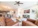 Inviting living room featuring a brick accent wall, modern decor, and stylish furnishings at 7925 Putting Green Way, Reunion, FL 34747